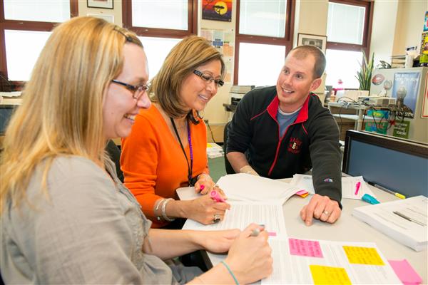 Educators reviewing documents