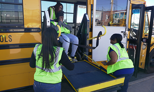 Drivers and paraprofessionals learn how to use the wheelchair life on the bus. 